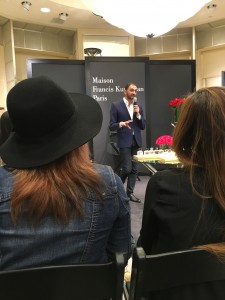 speaking to guests at Neiman Marcus