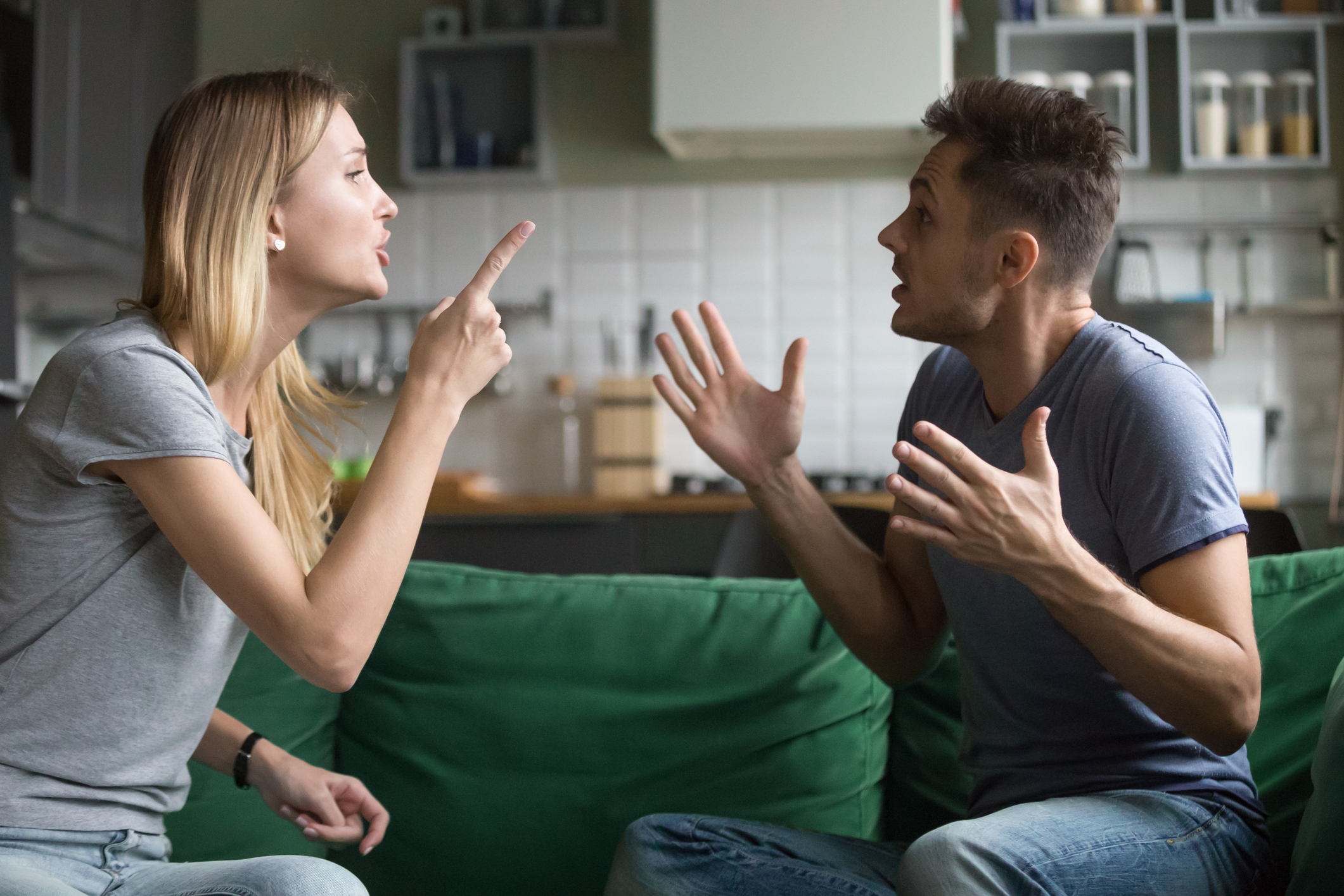 Angry millennial couple arguing shouting blaming each other of problems -  VUE magazine