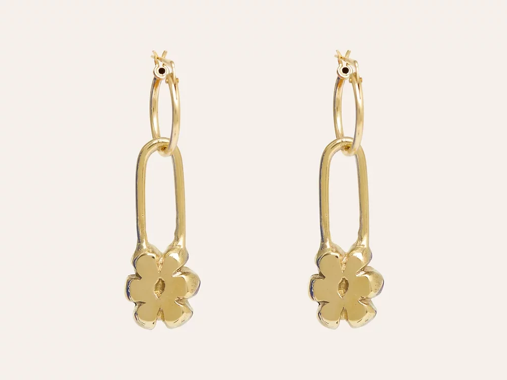 Gold huggie earrings. Safety pin shape with flowers.