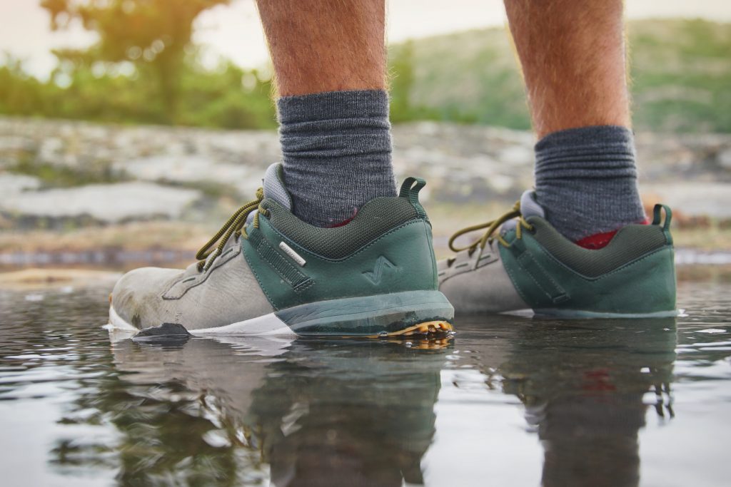 Hiking sneakers with dark green and grey colorblocking.
