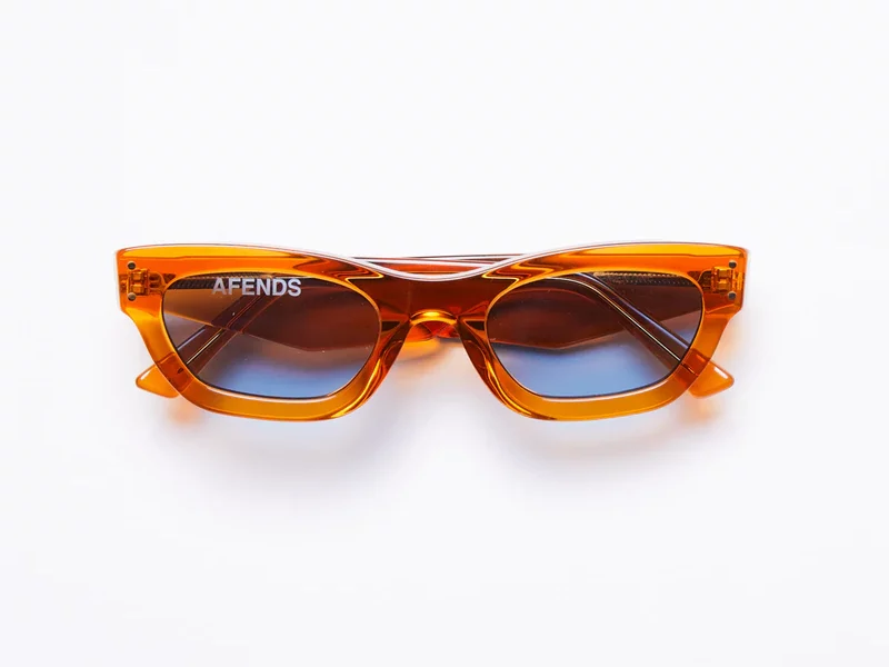 Clear orange frames with semi-rectangular shape and blue lenses.