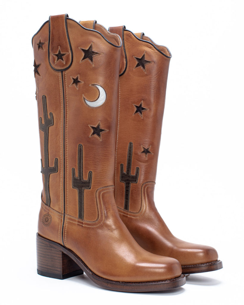 Brown leather boots cowboy boots with cactuses, stars, and moons.